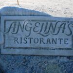 Restaurant logo sculpted in sand